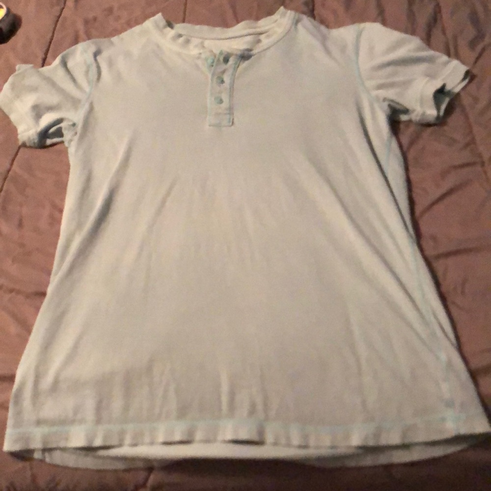 Light blue button up t-shirt. 100% cotton
